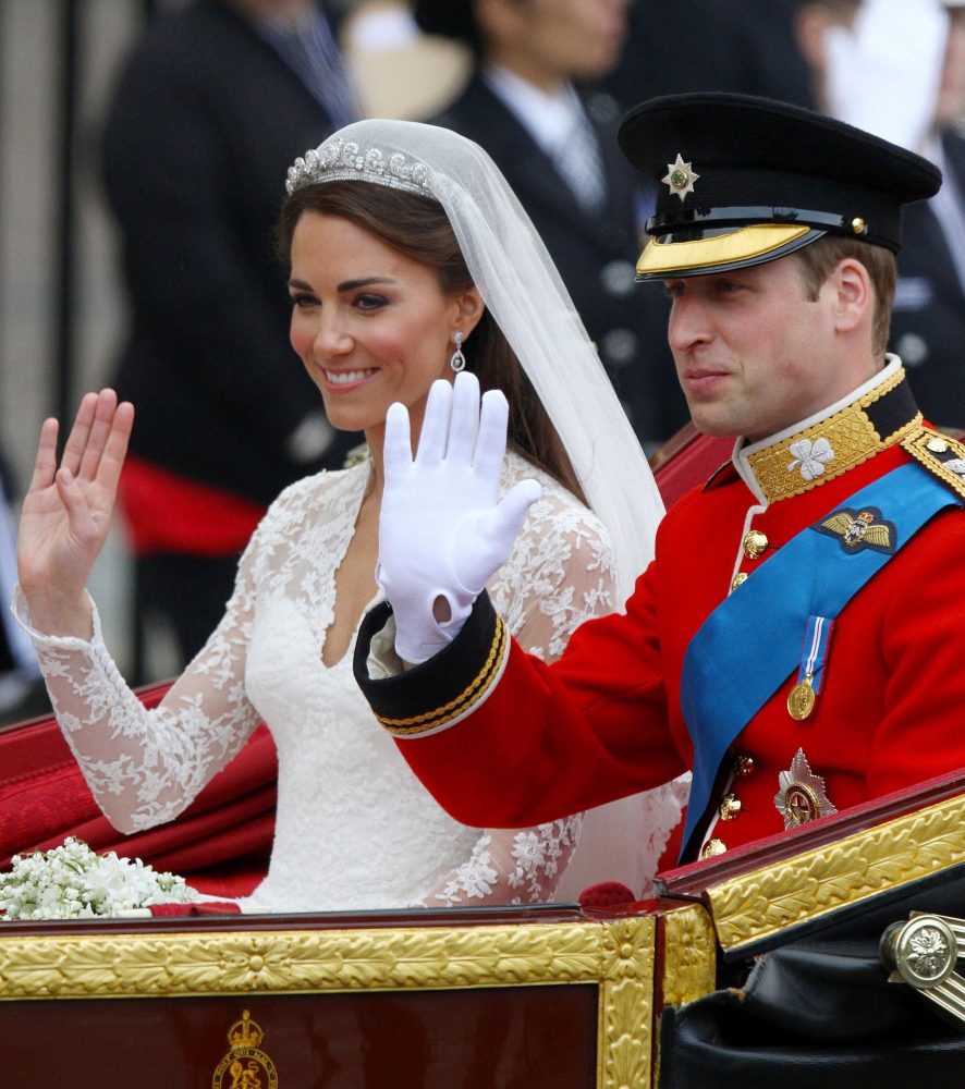 Prince William and his new bride, Kate Middleton, ride in a carriage after their wedding in London, England, on Friday, April 29, 2011. (Abaca Press/MCT)