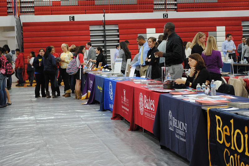 Colleges await interested students at their booths on College Night.  Photo by Vicky Robles.