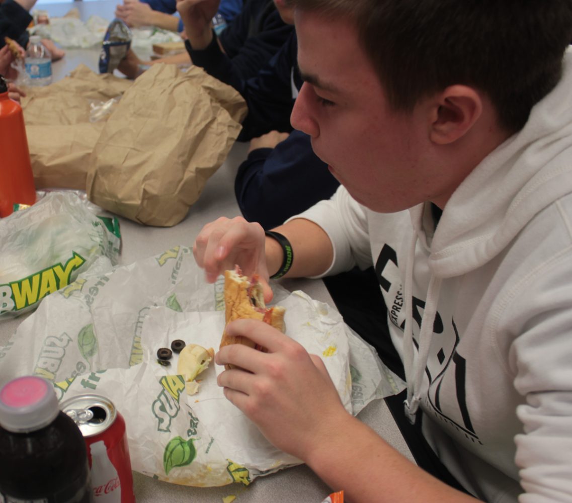 Junior John Kruk eats Subway to boycott Organic Lifes cafeteria food during #lunchstrike2013 Tuesday, Jan. 29. PHOTO by Alyssa Guzman