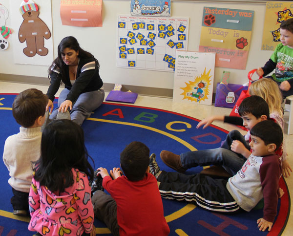 Senior Amara Fakhoury instructs a group of pre-school students last year. The community preschool closed its doors second semester. NWN File photo