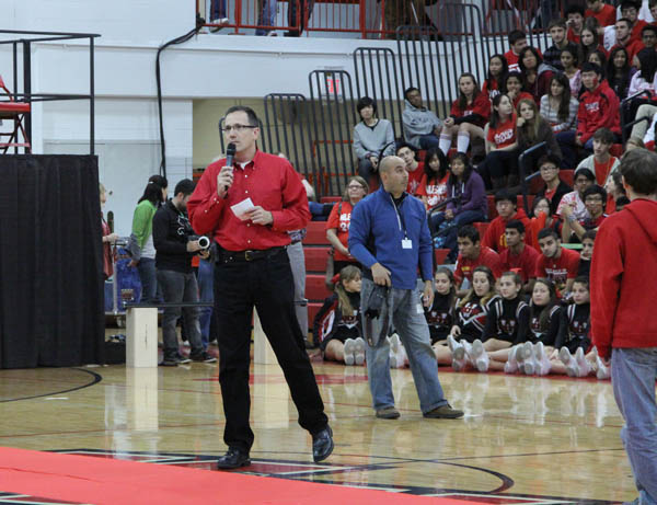 Principal Kaine Osburn speaks at the annual Homecoming assembly.