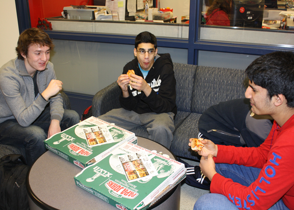 Students eat take-out pizza instead of buying lunch in the cafeteria Friday, Feb. 1. 