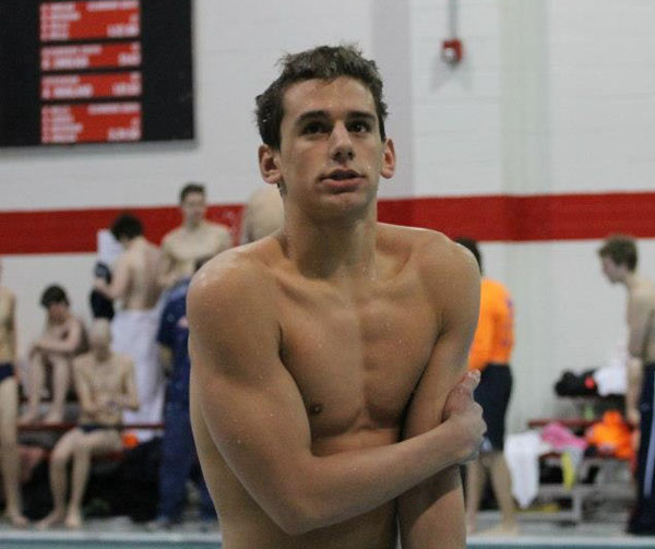 Senior Drake Nickell shivers after getting out of the swimming pool. Photo by Rebecca Yun.