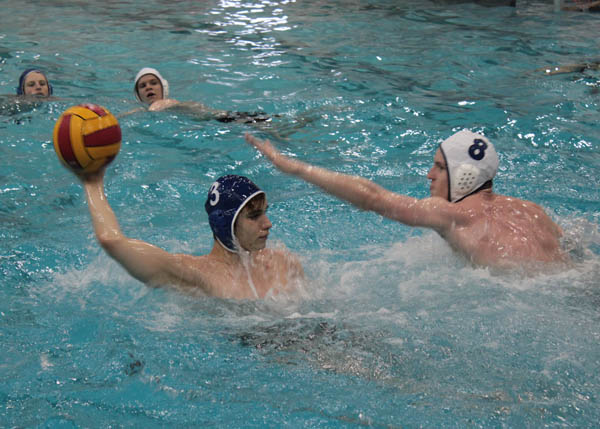 The water polo team spends much of their week in the pool during water polo practice. 