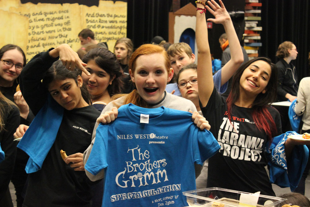 Cast members of The Brothers Grimm receive play t-shirts Thursday, Dec. 12. Photo by Katrina Nickell