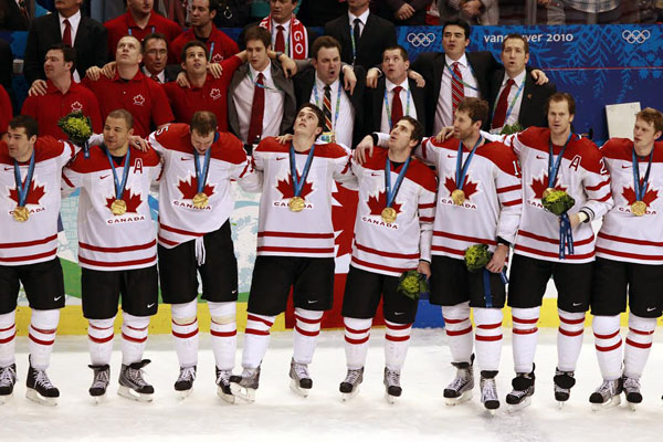 Team Canada hockey player stand together during the national anthem after receiving their gold medals for defeating the USA in overtime, 3-2, in the men's hockey final at Canada Hockey Place in Vancouver, Canada, Sunday, February 28, 2010. (Nuccio DiNuzzo/Chicago Tribune/MCT)