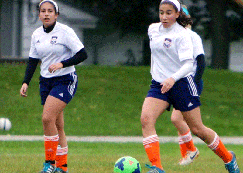 Sophomore Nikoleta Baxevanakis (right) participates in an away soccer game alongside sister, junior Despina Baxevanakis (left)