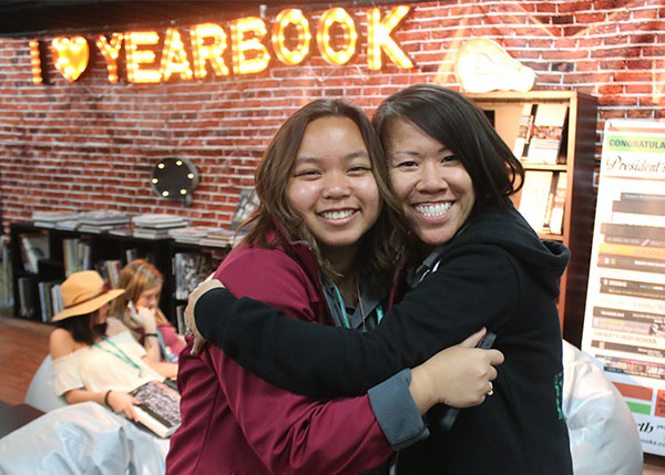 Senior Reiczel Bael from Kennedy High School in La Palma, CA, poses with advisor, Catherine Fong while walking around the exhibition room of the Spring JEA/NSPA Journalism Convention taking place at the Westin Bonaventure hotel located in Los Angeles, CA. Photo by Emily Butera