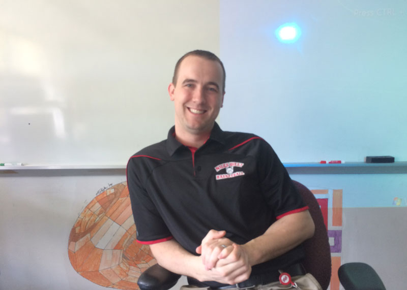 Girls varsity basketball coach and math teacher Kyle Braheny in his classroom. 