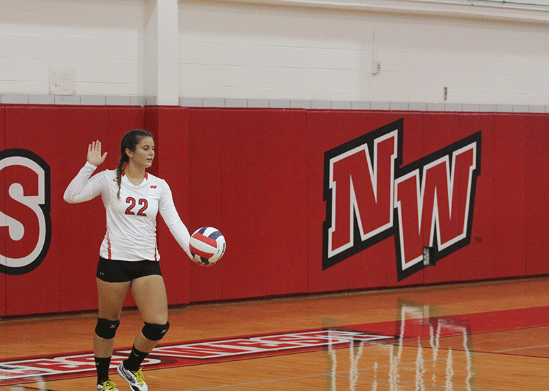 Senior Bianca Tomuta takes her place as the Libero in a game against Northside College Prep