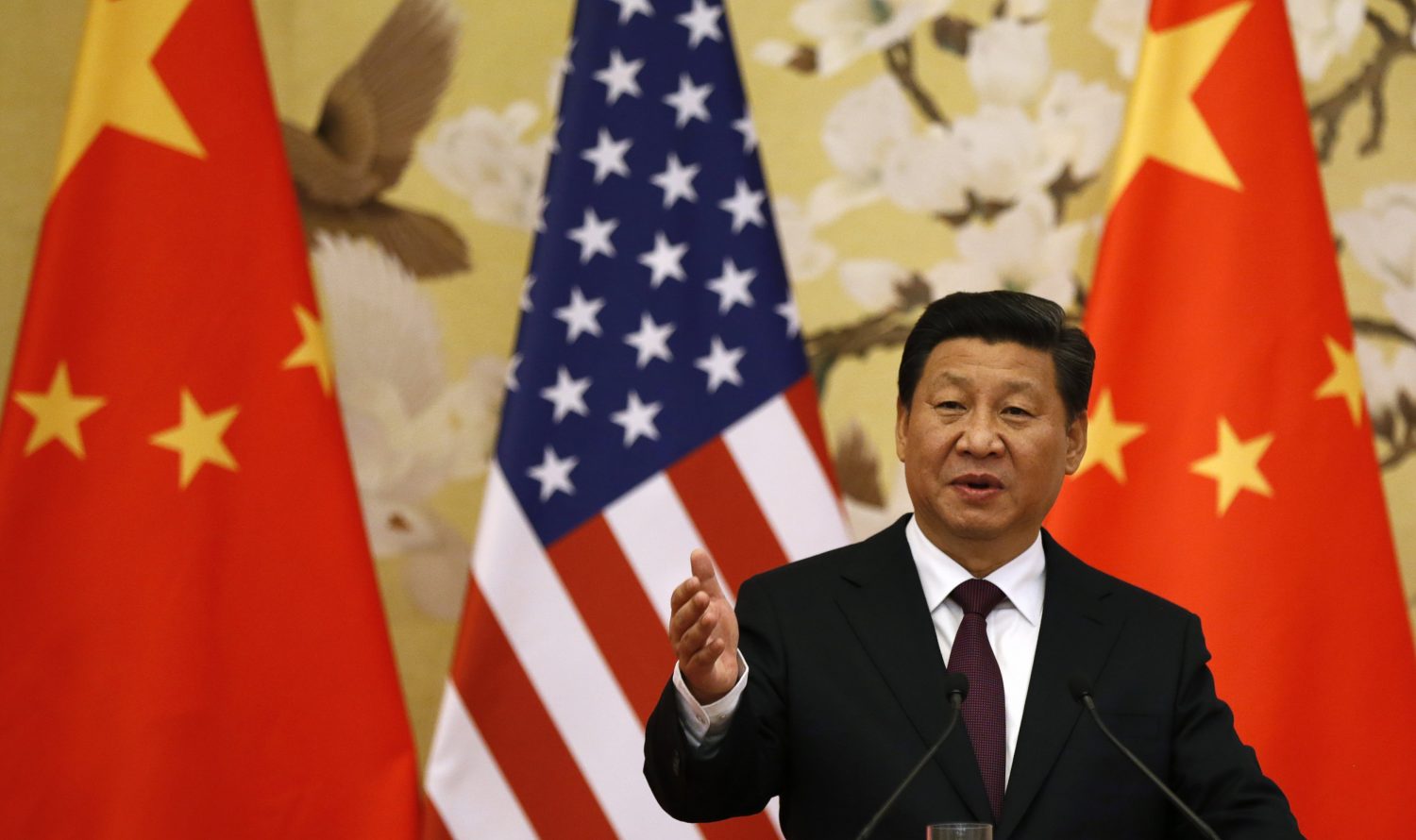 Chinese President Xi Jinping speaks during a news conference with U.S. President Barack Obama (not pictured) in the Great Hall of the People in Beijing, in this November 12, 2014 file picture. From a military rules-of-the-road agreement with Washington to $20 billion in loans for Southeast Asia, Beijing has set aside the tensions of recent years to present a softer side to the world in the last week. But proof of whether President Xi Jinping is serious about narrowing differences that have marked his first two years in office will depend on how China's festering disputes are managed in the months ahead. To match Analysis CHINA-DIPLOMACY/         REUTERS/Kevin Lamarque/Files  (CHINA - Tags: POLITICS)