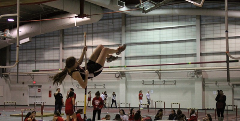 A pole vaulter on the girls indoor track and field season practices during the 2017 season.