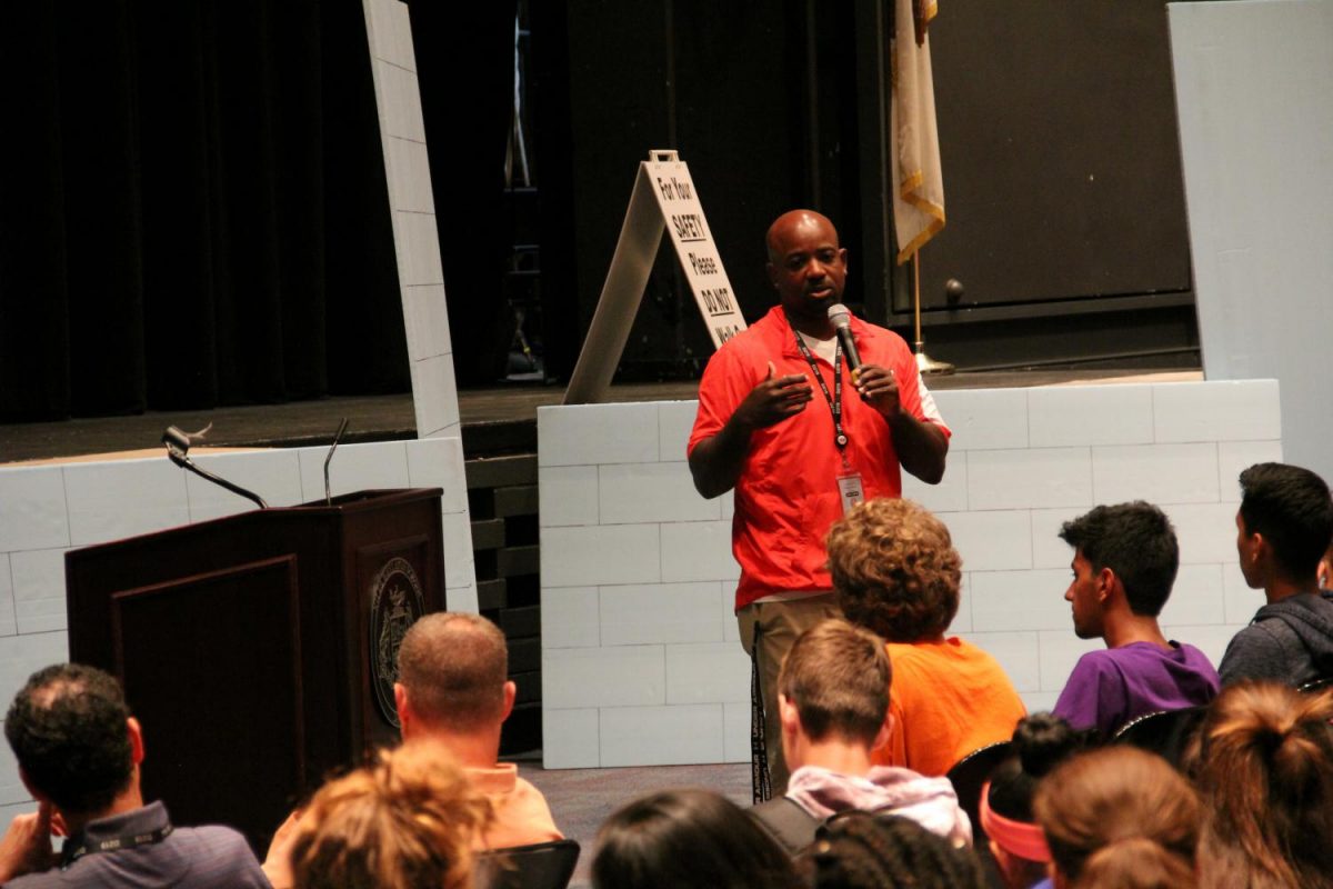 Athletic Director Kendall Griffin speaks to student athletes after school on Wed., Sept. 27.