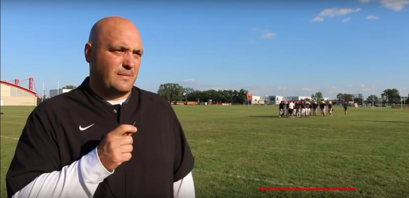 Head Football Coach Jesse Pierce runs a practice.