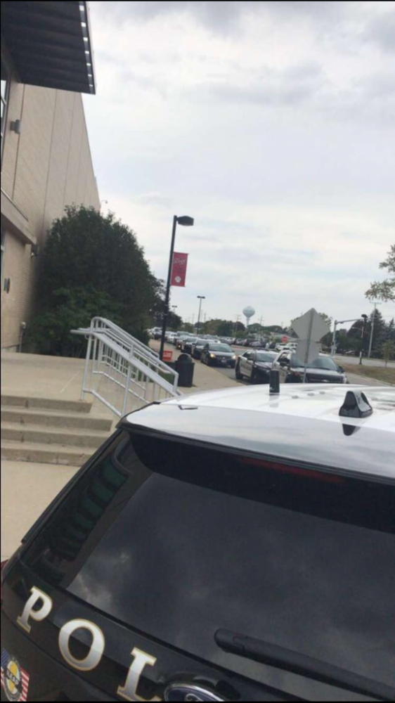 Police arrive at Niles West High School in response to 911 tip.