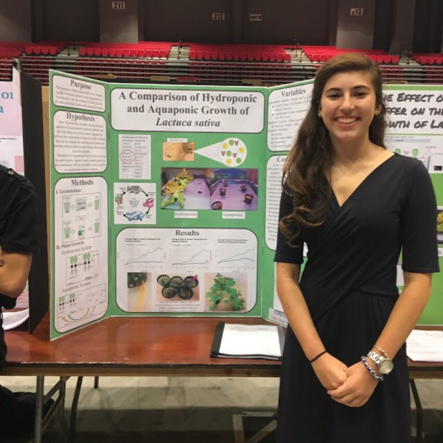 Junior+Katie+Benstead+presents+her+STEM+research+project.+