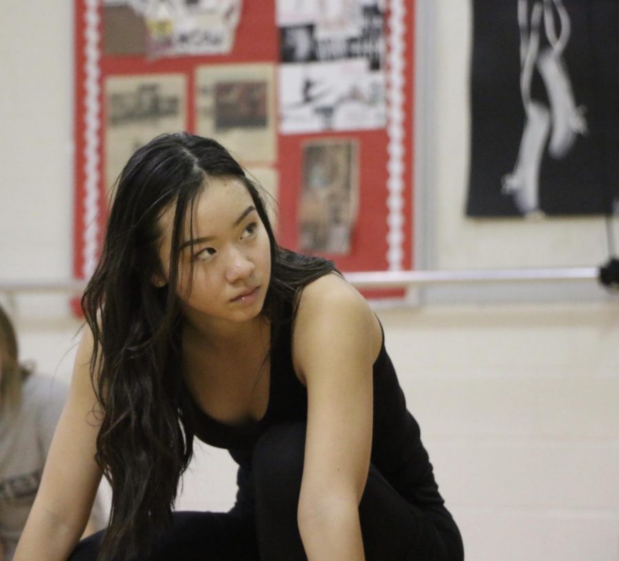 Senior Audrey Choi warms up during a varsity Poms practice.