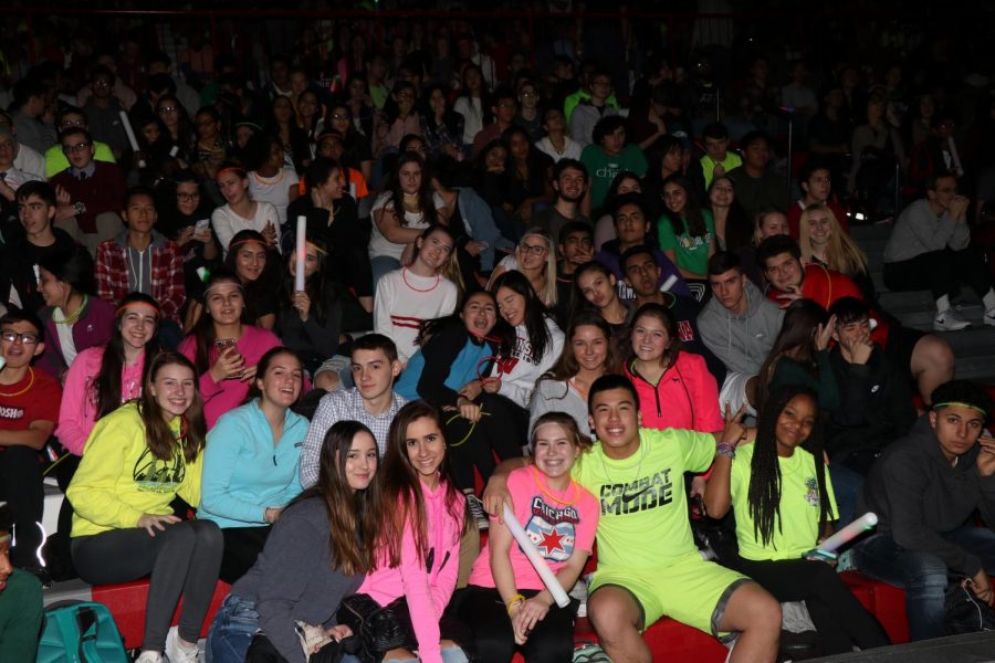 The junior class shows off their spirit for the winter pep assembly last year by wearing neon.