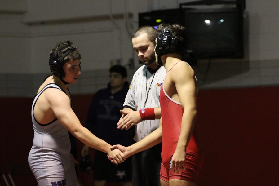 December 8 senior Andrew Arnautu wins his match helping Niles West take home the traveling trophy. 