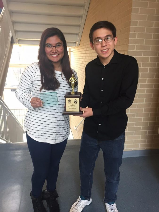 Sihah Reza (left) after winning an award at a national tournament. 