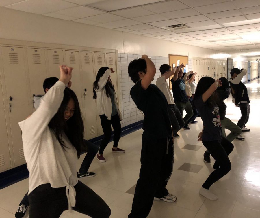 Students in Asian Pop Culture Club practice their dance during a meeting. 