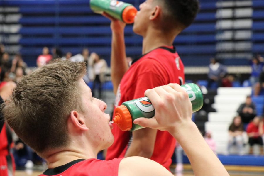 Senior Jack Milios and Junior Kevin Guillaume staying hydrated during the game. 