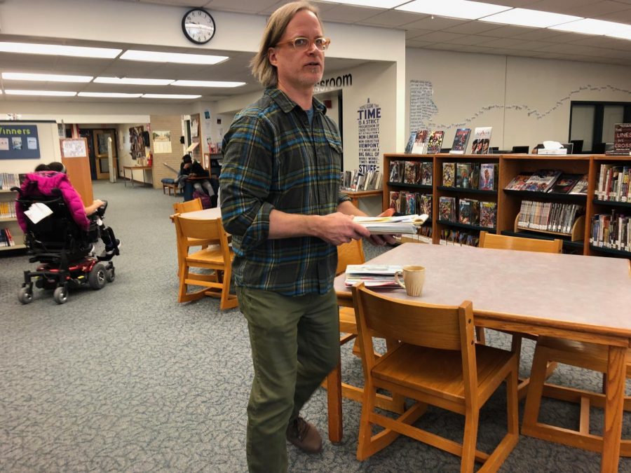 Social Studies teacher, Matt Weatherington candidly walking through the IRC. 