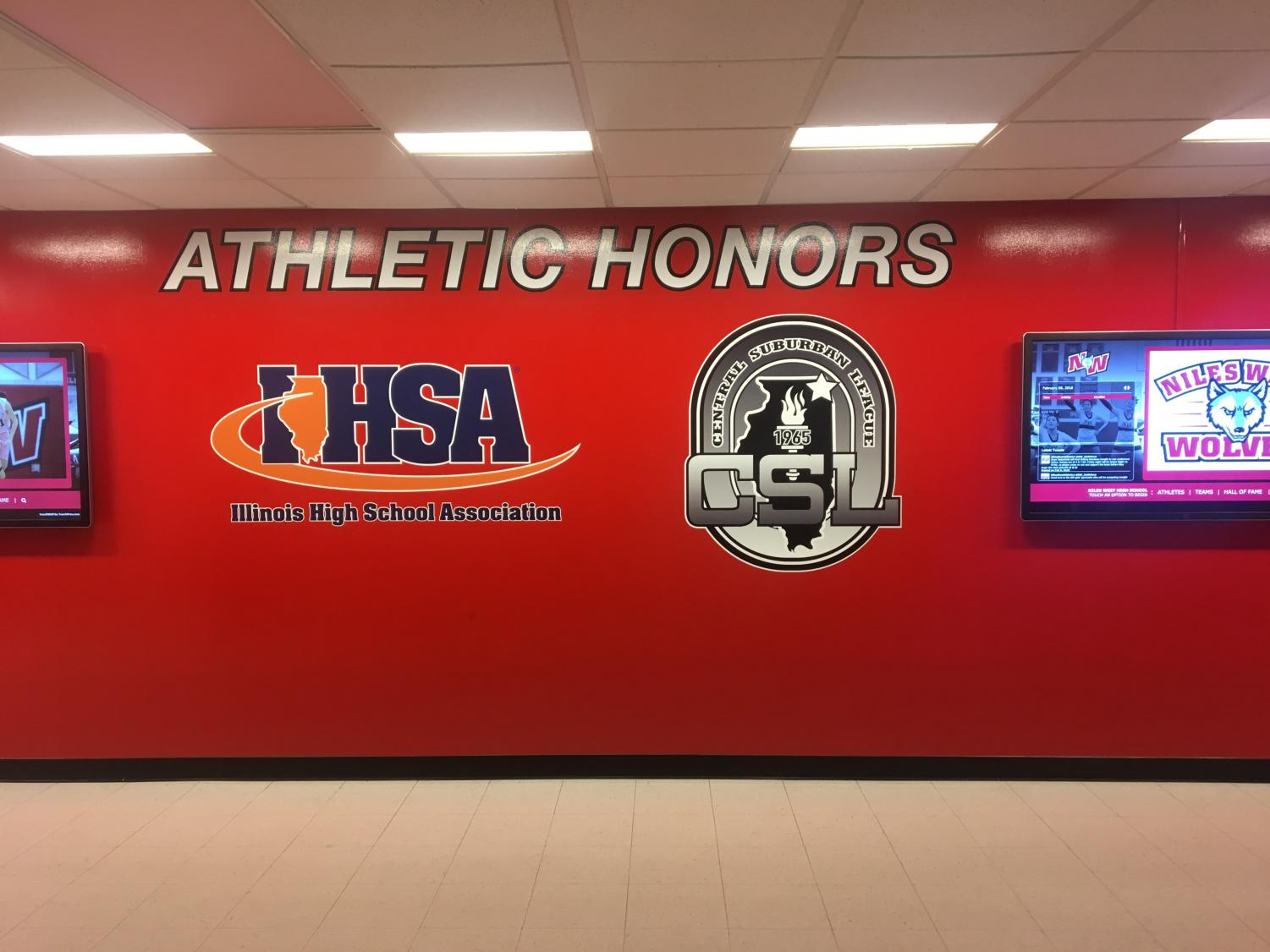 The newly painted and updated Athletic Honors wall, complete with two new touch screen display monitors.