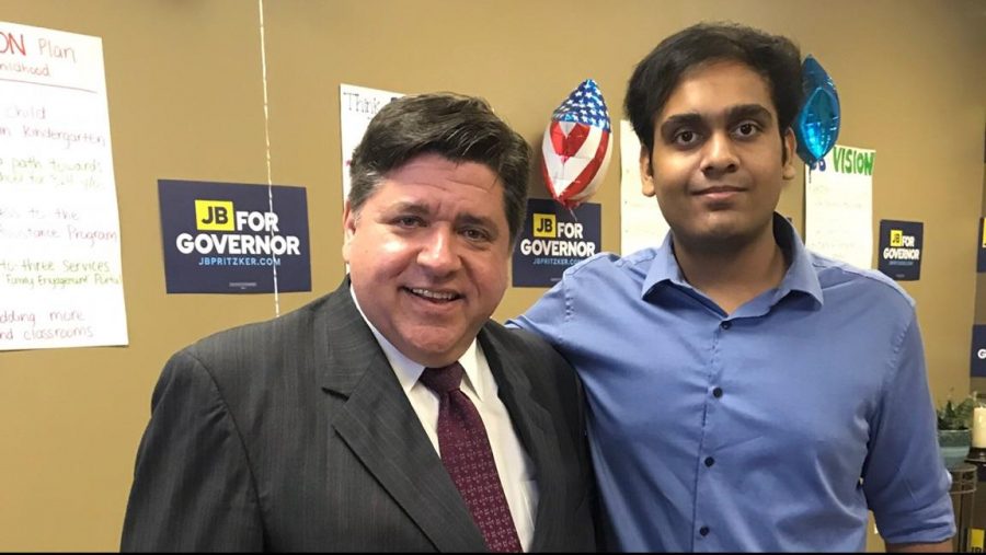 Gubernatorial candidate J.B Pritzker with junior Umar Ahmed, who volunteers on his campaign.