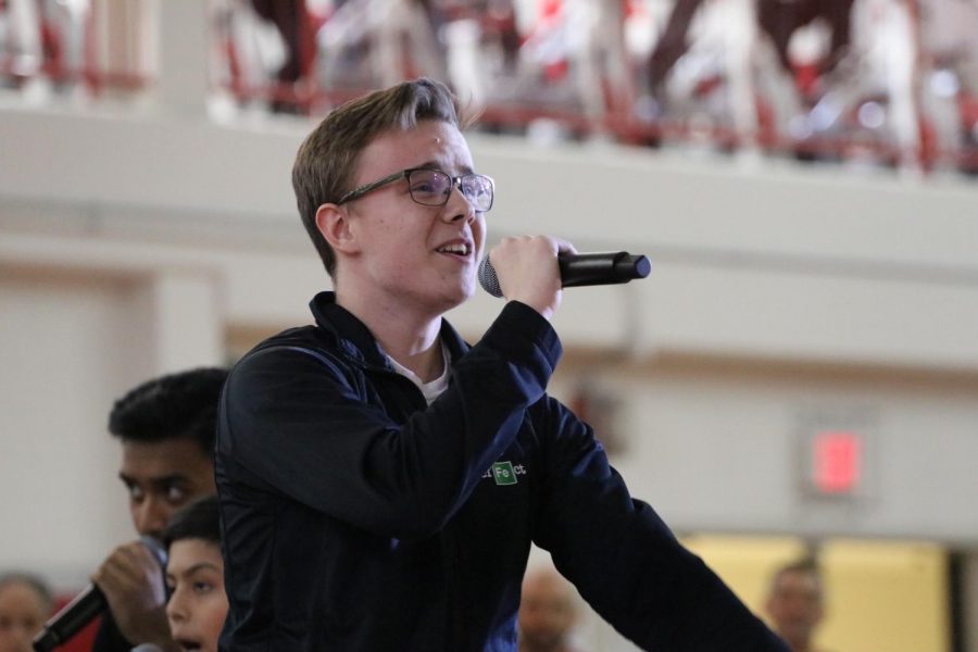 Senior Chris Witt singing during the pep assembly in Echo Effect. 