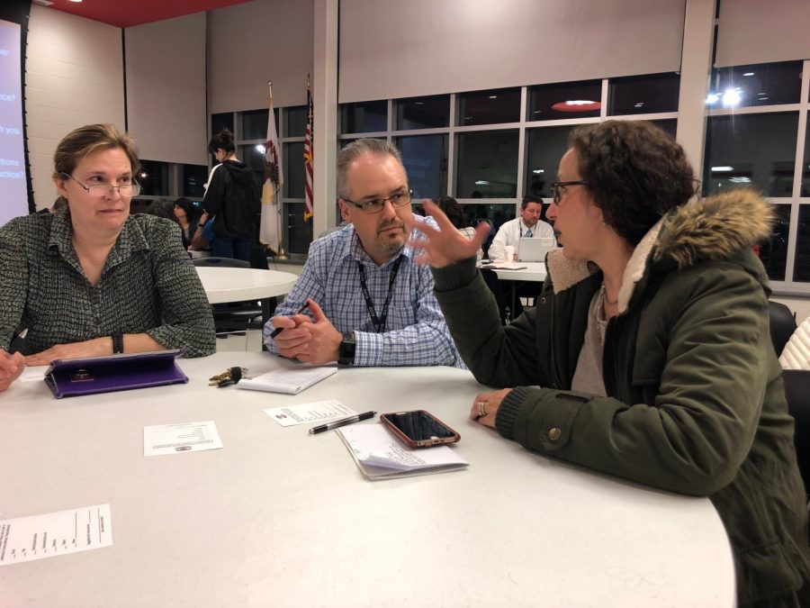 Parents speak with West administrators during safety forum.