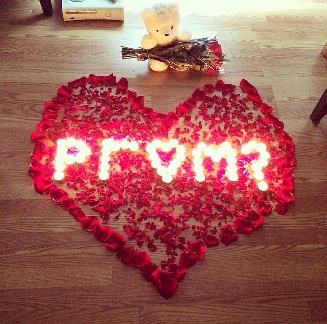 Roses extravagantly displayed in the shape of a heart, asking somebody to prom. 