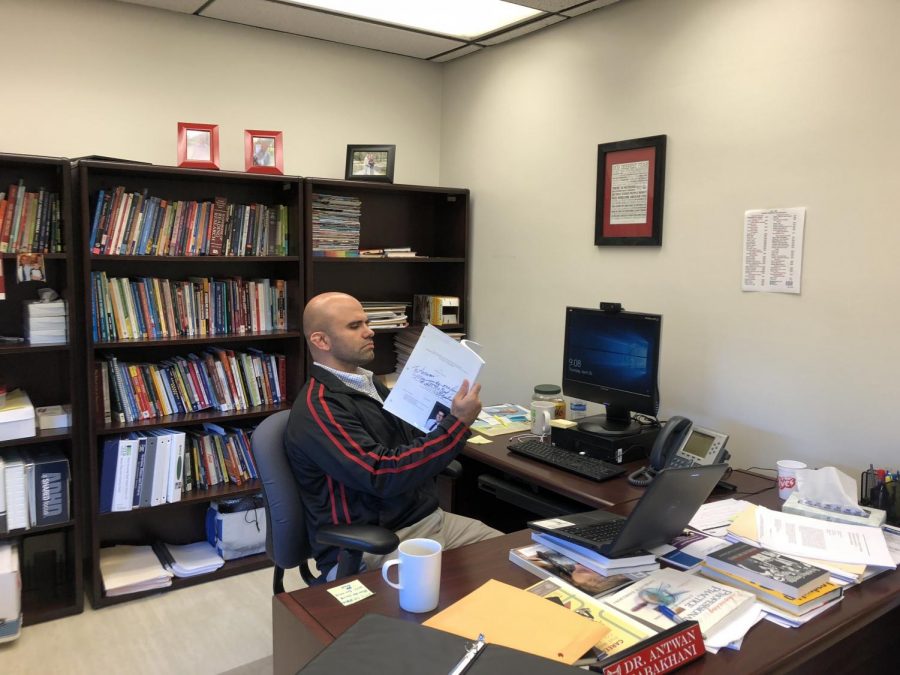 Antwan Babakhani focusing on work in his office. 