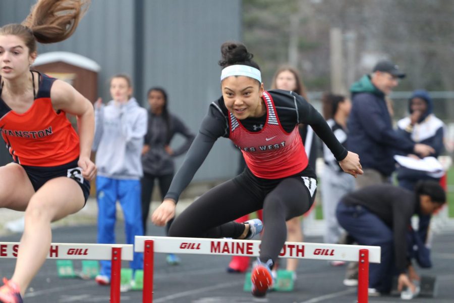 Tiffany Chin completing her hurdles for the competition.