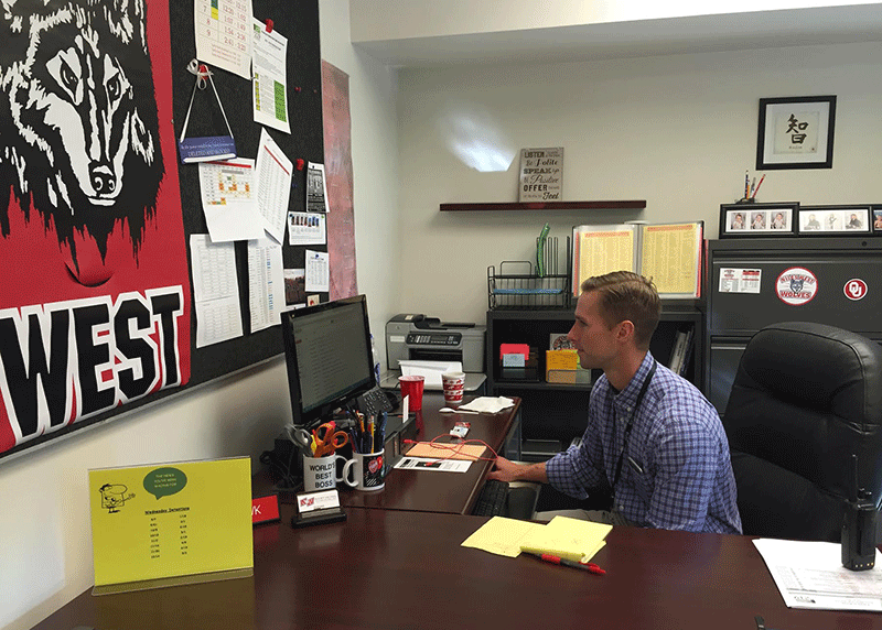 Dean Hawk diligently works at his desk. 