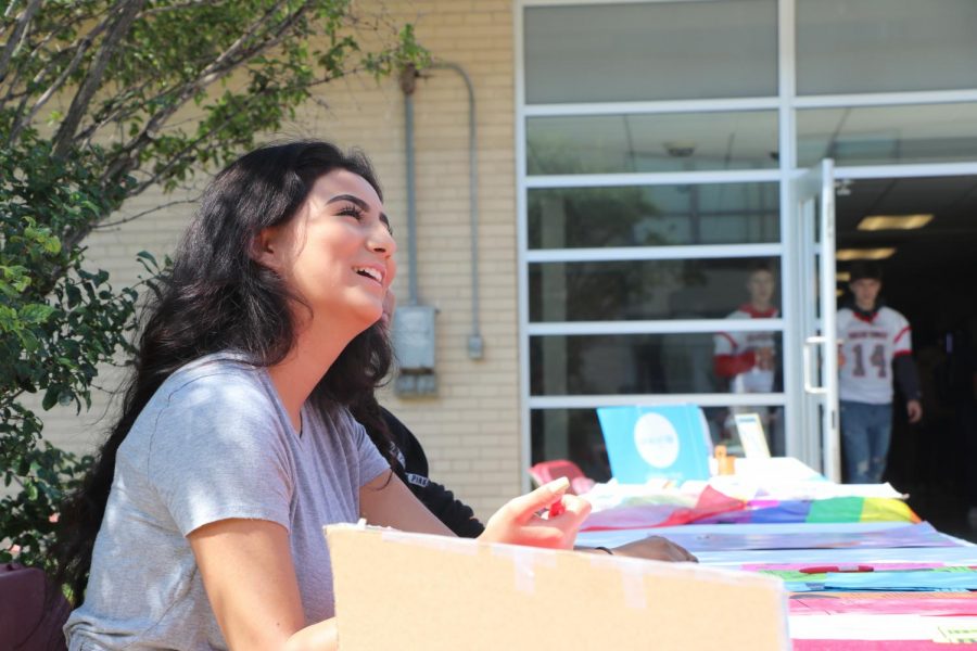 Student expresses their passion for Future Latino Club at Activities Fair. 