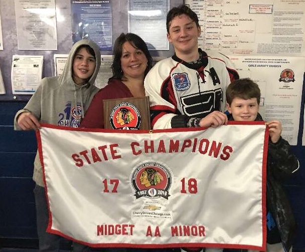 Senior+Austin+Kessem+with+his+mother+and+brothers%2C+after+winning+the+State+Championship.