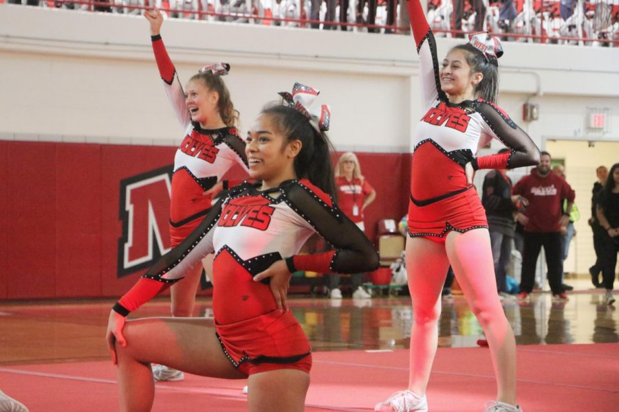 Cheerleading team ending their performance during the assembly. 