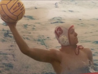 Junior Brian Pryzby immerses himself in the water polo game. 