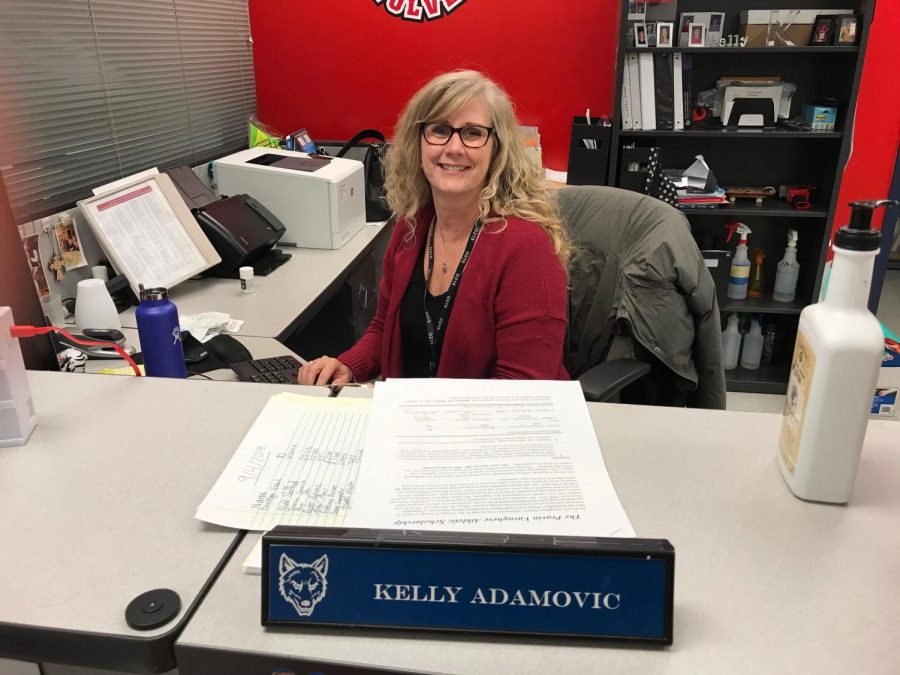 Assistant Activities director, Kelly Adamovic, sits at her desk, ready to take on the day with a smile.