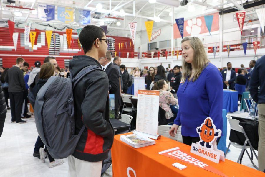 Student asking the Syracuse University representative about the college itself. 