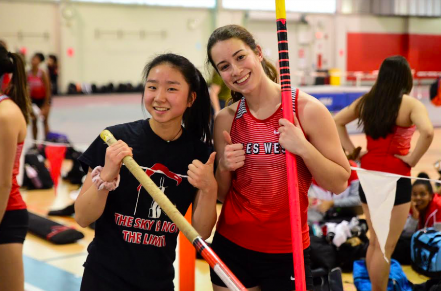 Junior Hana Choi (left) posing alongside a teammate before a meet. 