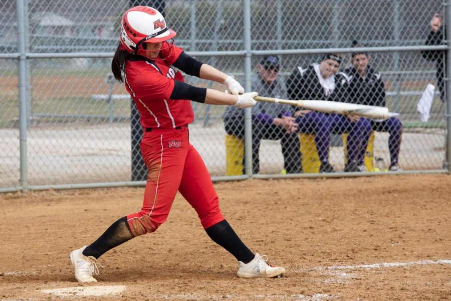 Junior+Julia+Ruth+mid-swing+during+one+of+the+softball+games.+