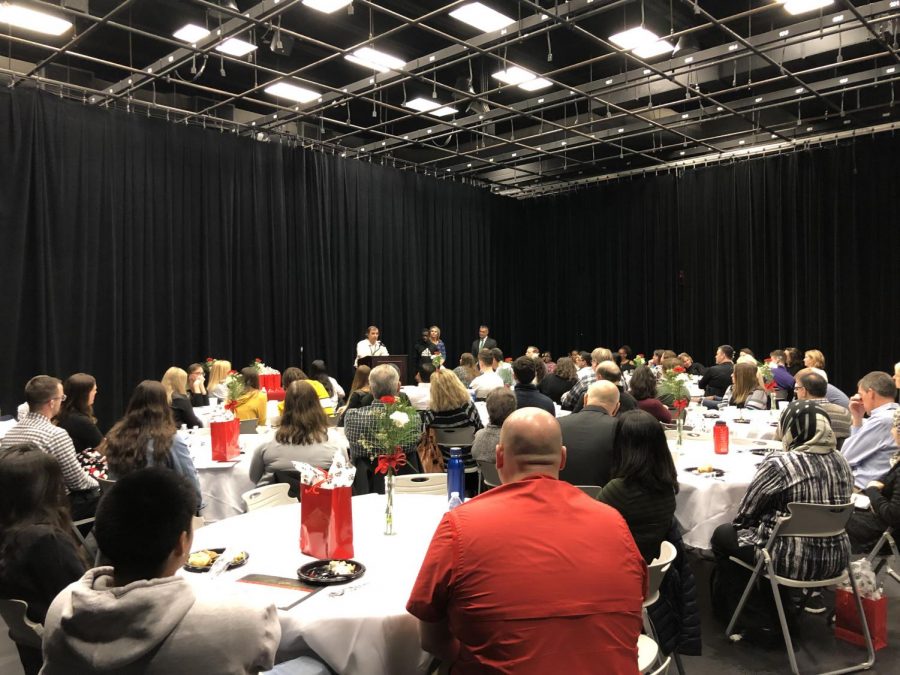 The crowd listens to speaker at the Principals Recognition Breakfast. 