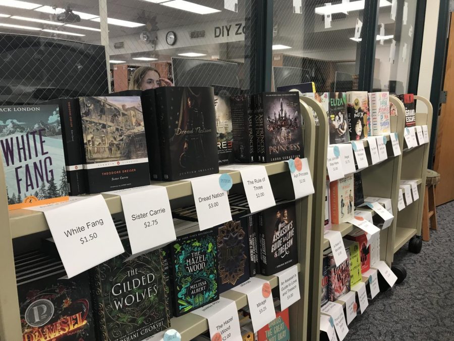 Summer reading book rack placed next to Mrs. Baehrs desk in the IRC.