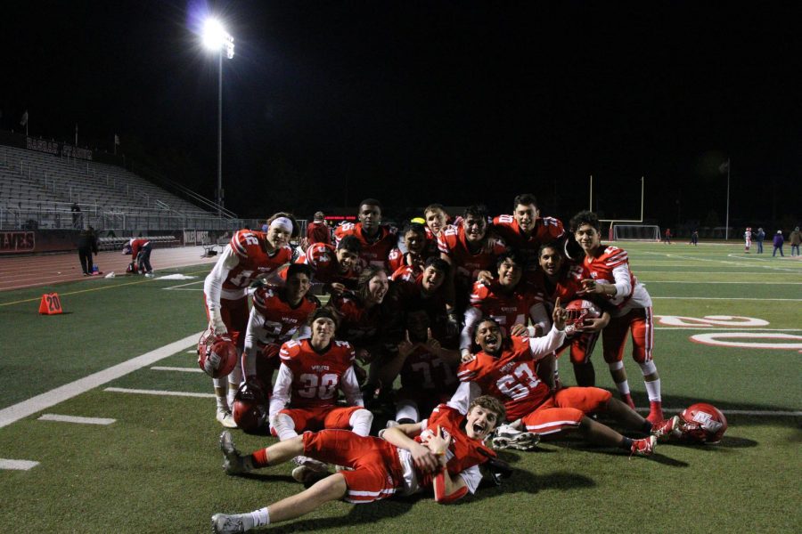 Varsity football coming together with the seniors for their last home game.