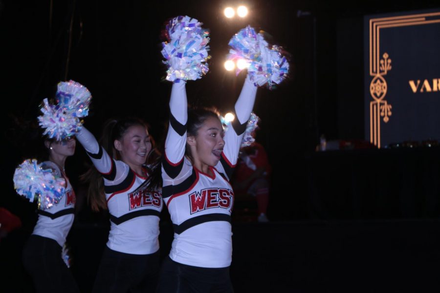 Varsity poms performing a routine in front of the Niles West student body.