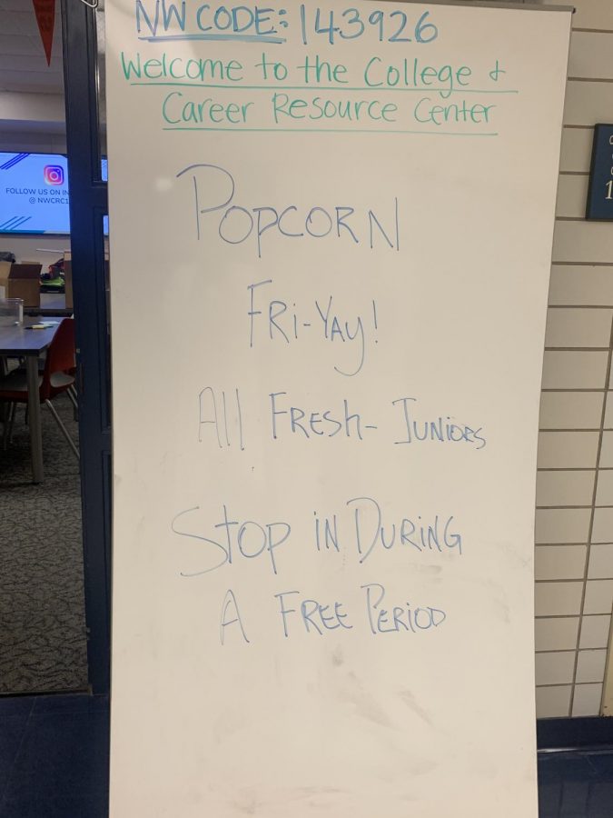 College Resource Drop in Day is advertised with a whiteboard outside of the center 
