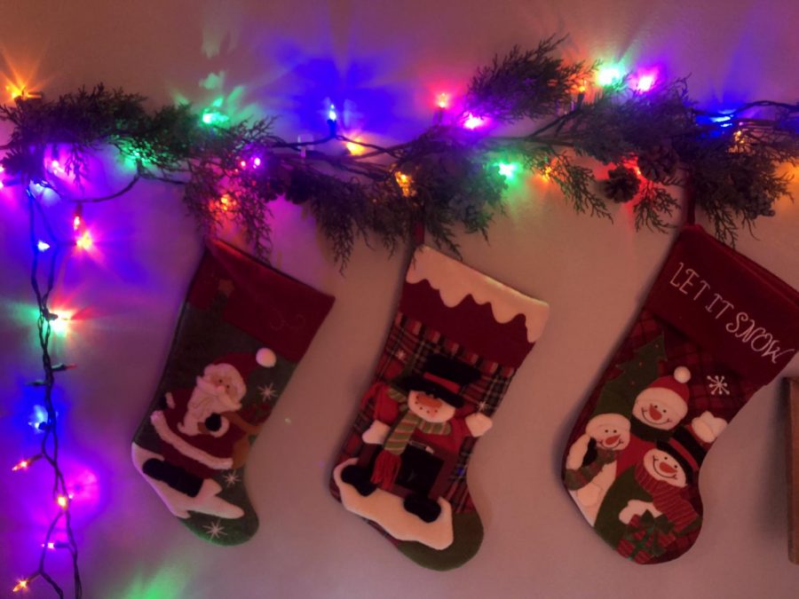 Stockings hung up and decorated with holiday cheer. 