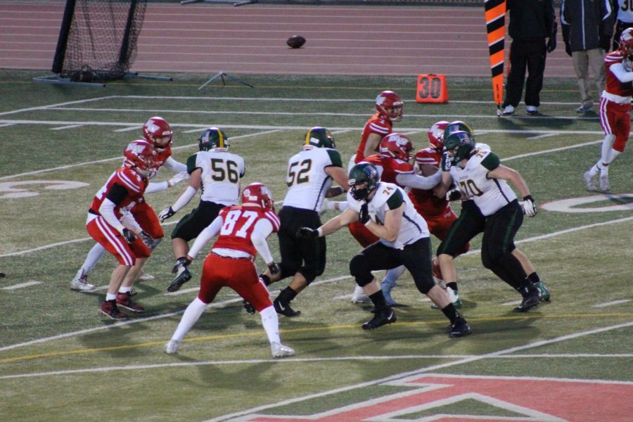 Wolves and Spartans clash on the football field.